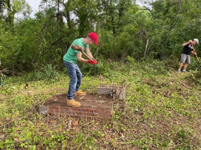 David Mann working in field with a hammer